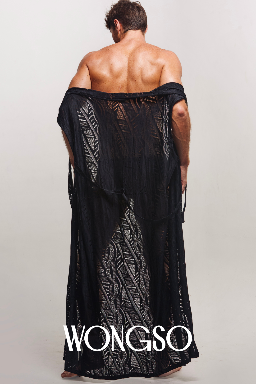 Back view of men's sleeveless kimono with hand-drawn batik in midnight tones