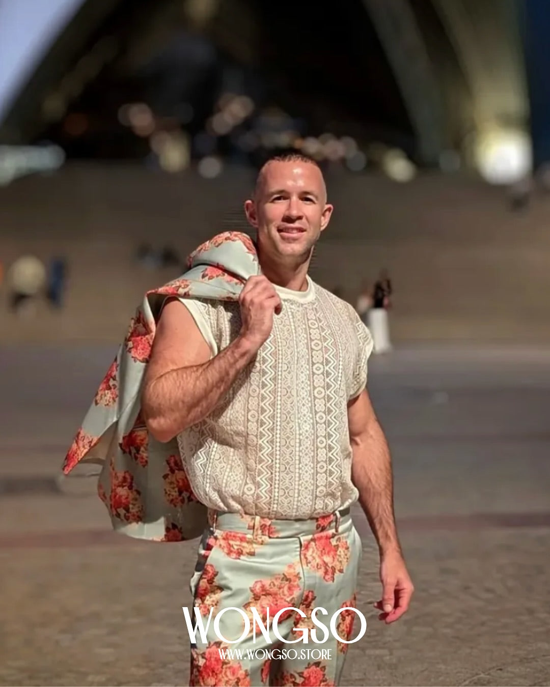 Model in the White Lace sleeveless shirt on a harbour promenade