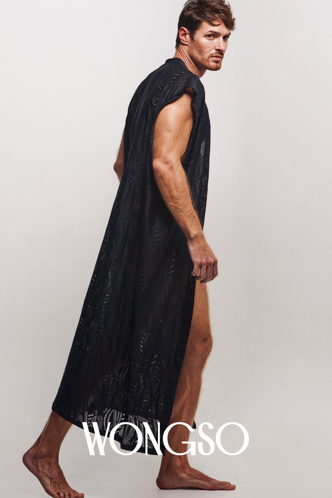 Model wearing sleeveless black batik kimono for men,