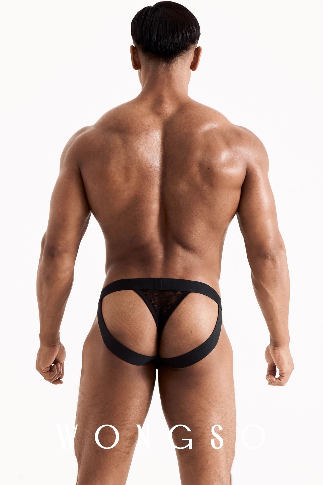 Full body back view of the WONGSO leopard print lace jockstrap thong on a male model. Men's festival intimates.