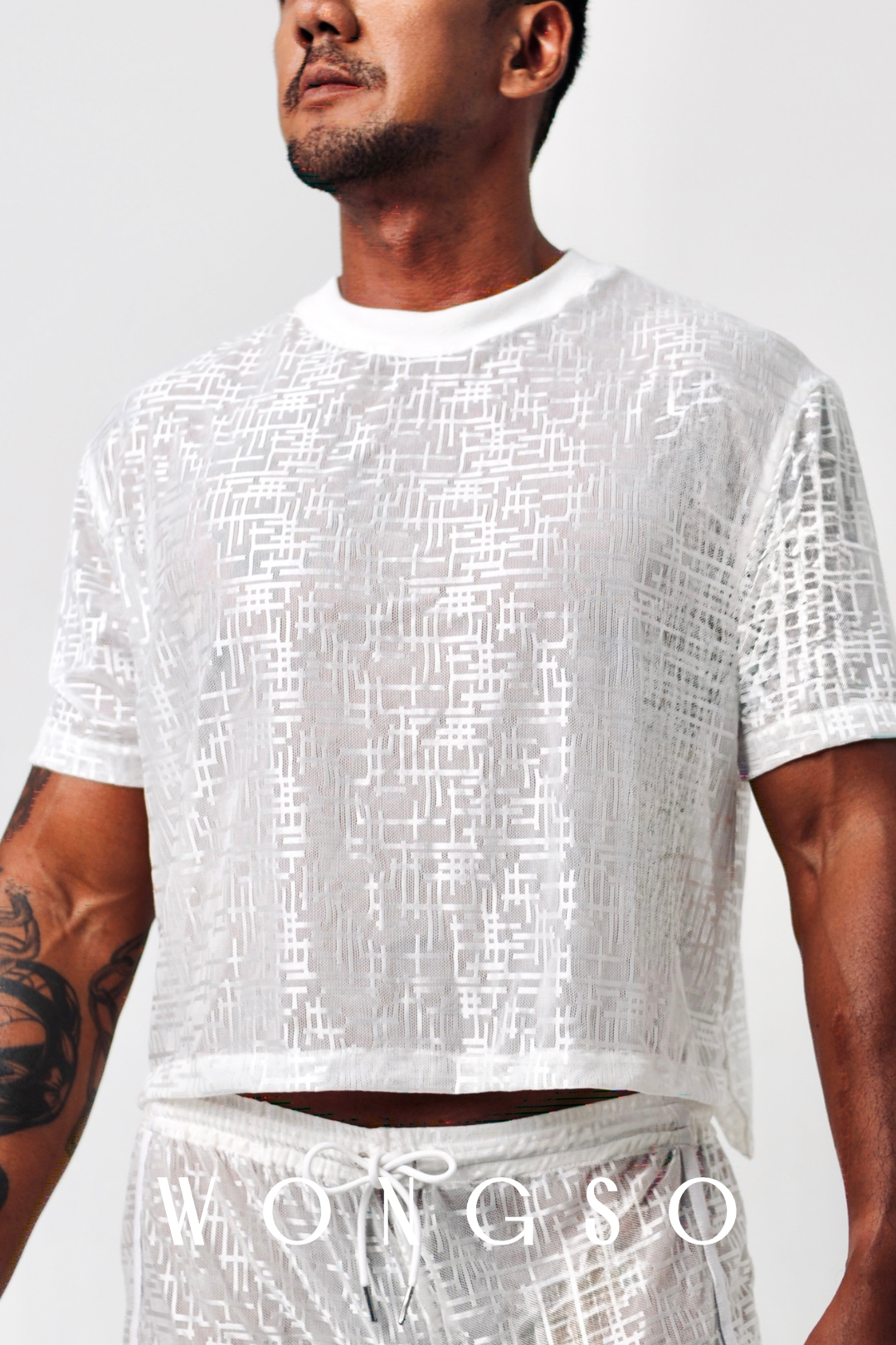 Close-up silver-thread woven detail on men’s boxy cut shirt – Libertine Collection