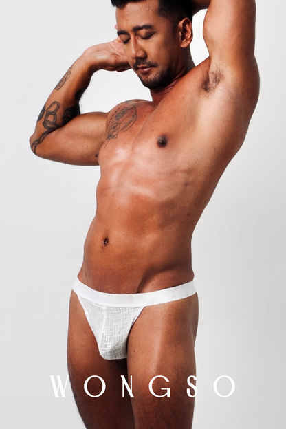 Side View: Back view of men’s thong in silver white sheer fabric – Libertine Collection