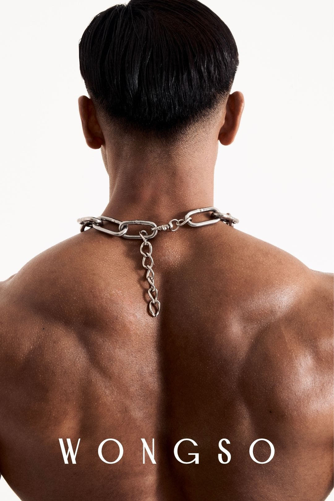 Close-up back view of the WONGSO stainless steel chain necklace, showing the brass hook clasp at the nape. Men's chunky chain necklace.