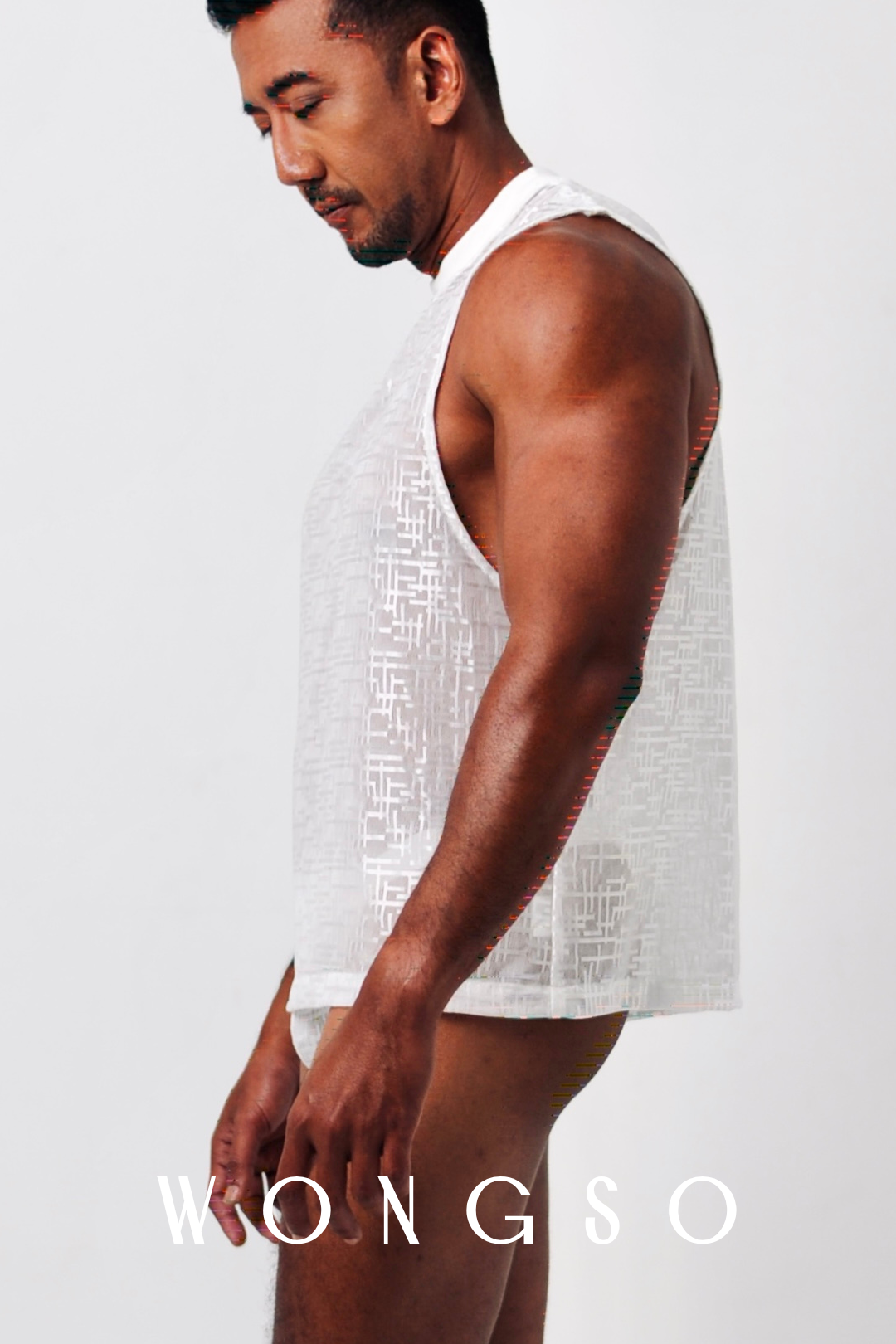 Side View: Side view of see-through silver-white men’s tank top – Libertine Collection
