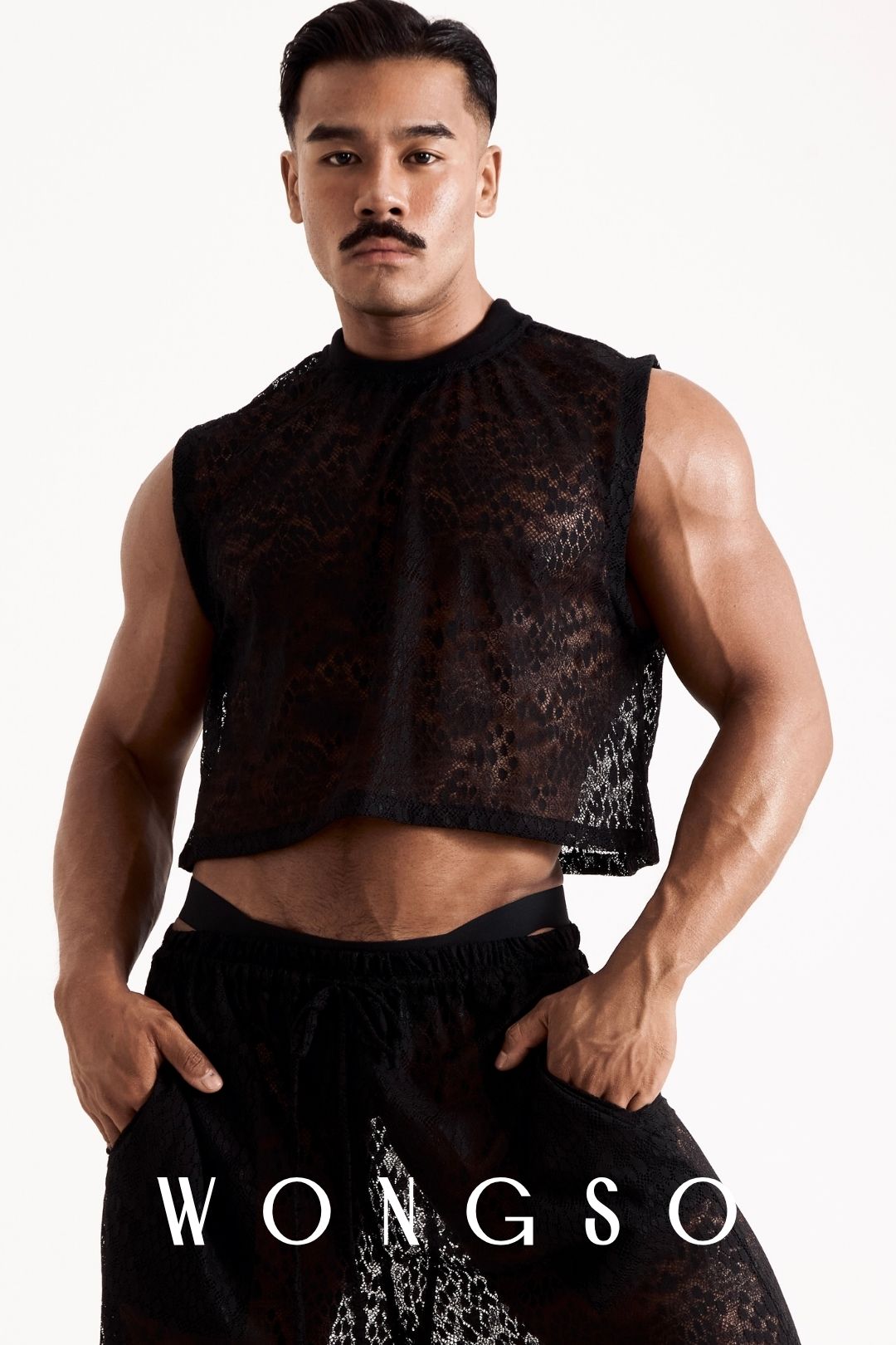 Close-up front view of the Libertine Crop Lace Top in Leopard Black by WONGSO, showing the mock neck and boxy cut in leopard print lace. Men's cropped festival top.
