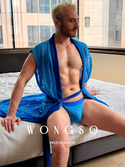Model in the Bali Blue lace robe seated on a bed