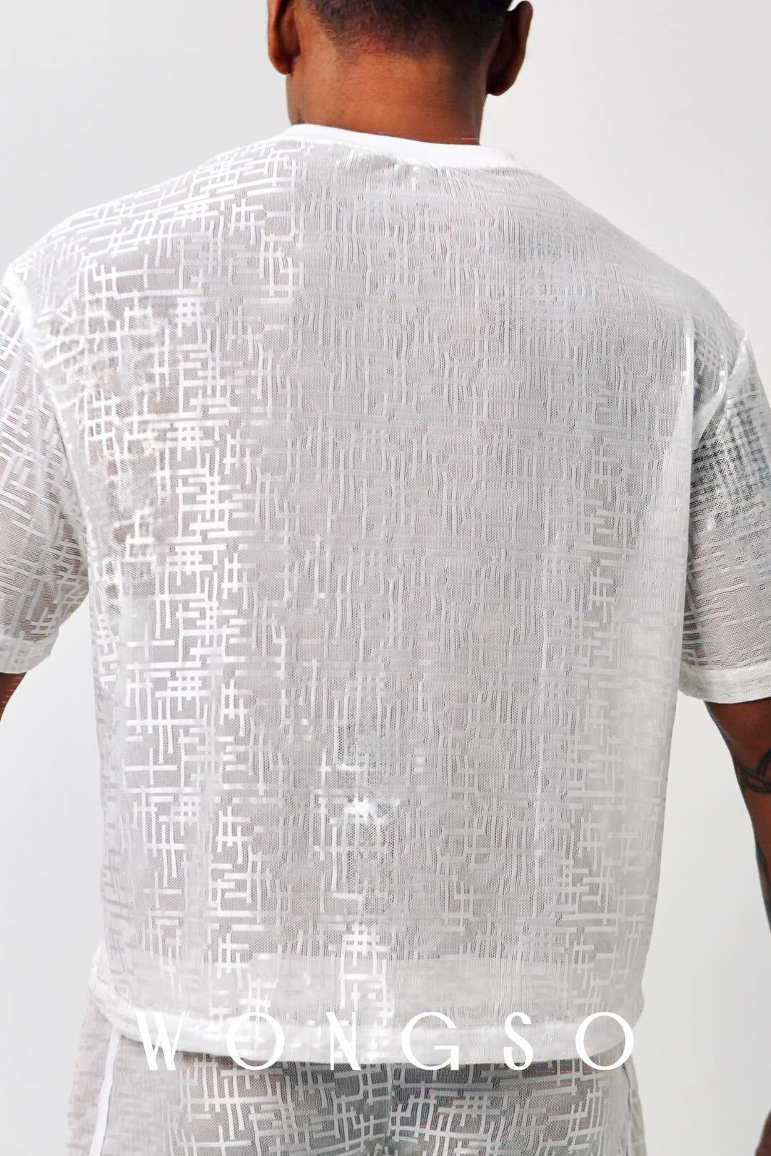 Back close-up of the textured sheer fabric on WONGSO's boxy cut shirt in silver white