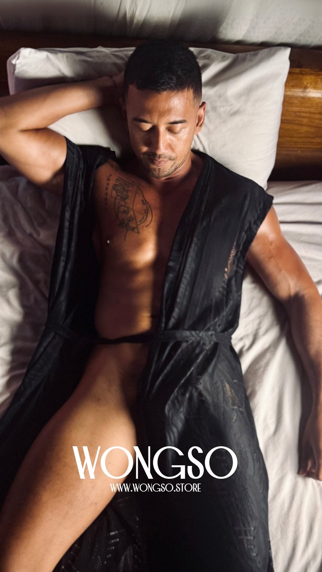 Model in the Black Batik sleeveless kimono lying on a bed