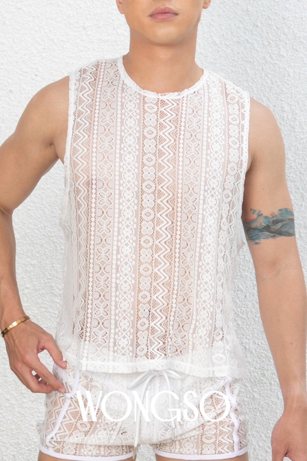 Close-up of the sheer white lace texture on WONGSO's festival tank top