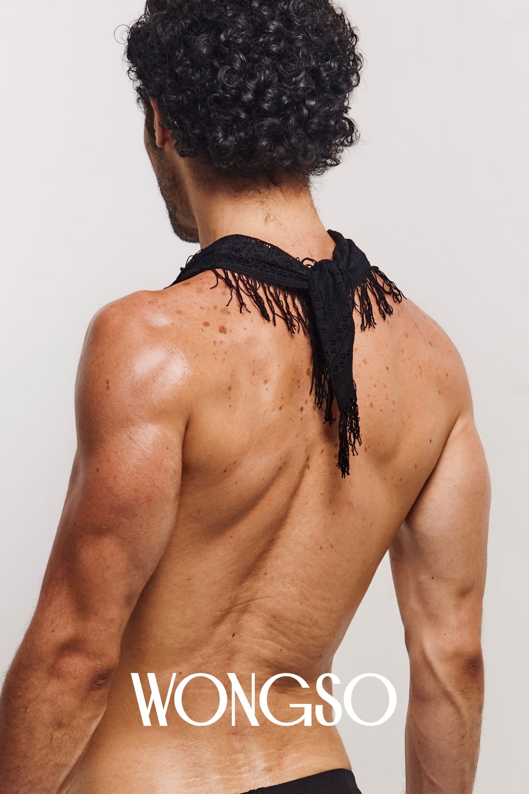 Model styling the WONGSO black lace bandana for a festival look