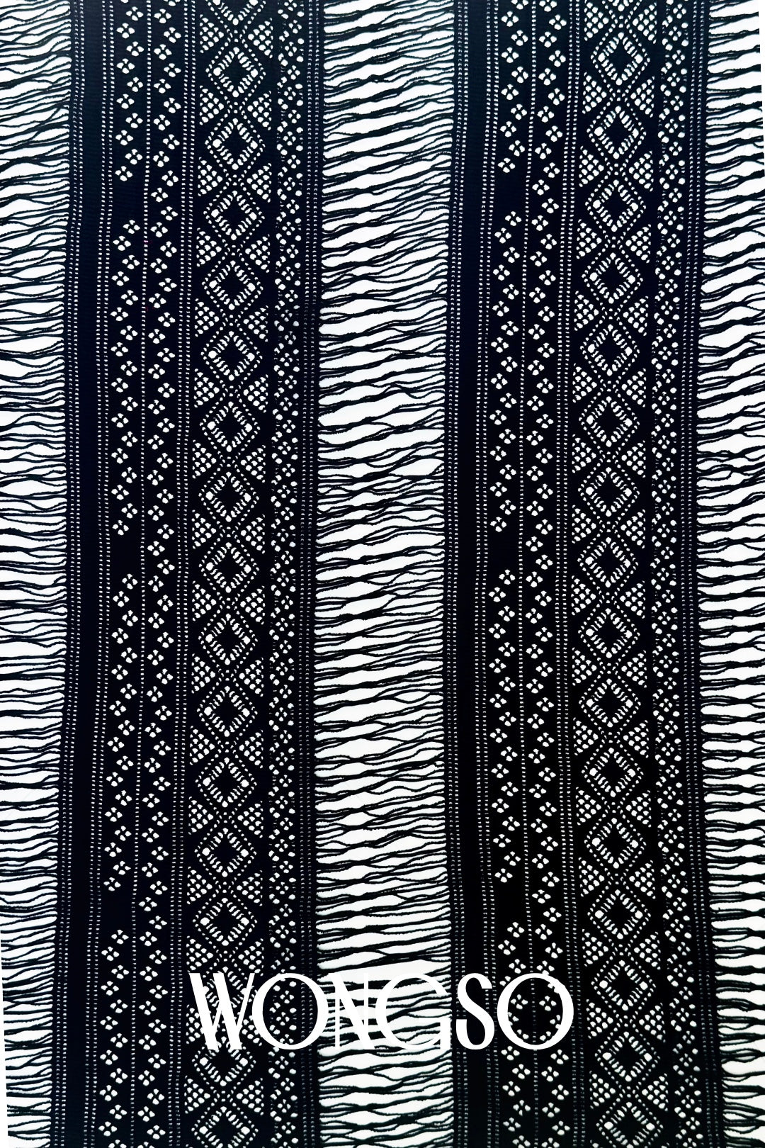 Close-up of the black fringe detailing on WONGSO's men's sarong wrap