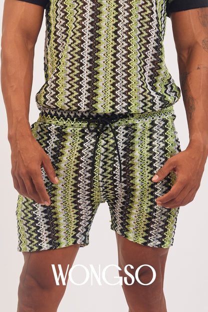Model styling WONGSO Green Knit Shorts with a matching green polo shirt