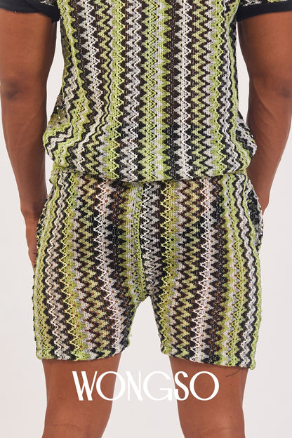 Close-up detail of the vibrant green knit texture on WONGSO's festival shorts