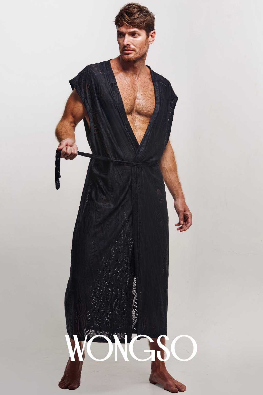 WONGSO sleeveless black kimono robe in motion, sheer batik detail