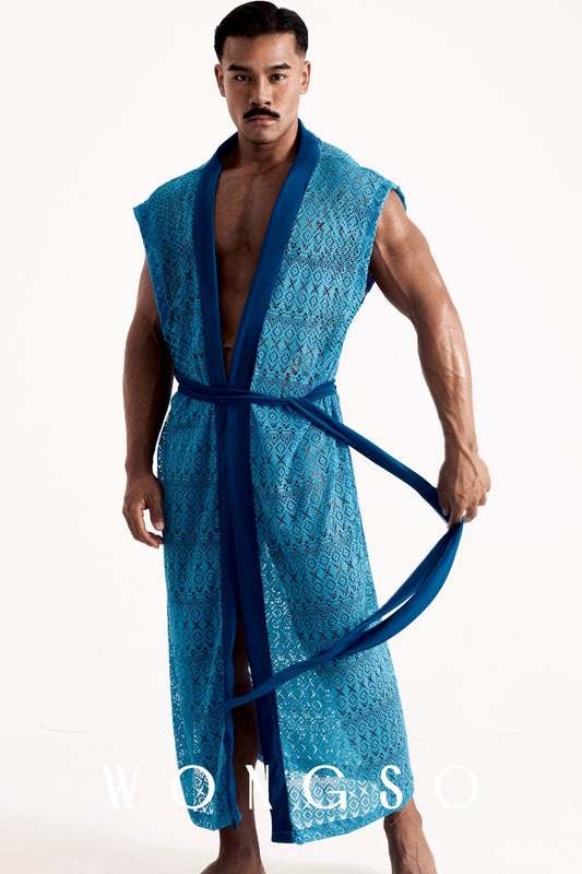 Full body front view of a muscular male model wearing the Boheme Sheer Lace Kimono in Bali Blue by WONGSO, featuring a solid lapel and sheer geometric lace styled slightly open with a tied waist