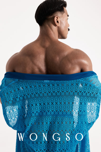 Close-up back view of the sheer blue lace WONGSO kimono styled off the shoulder, showing the geometric lace pattern