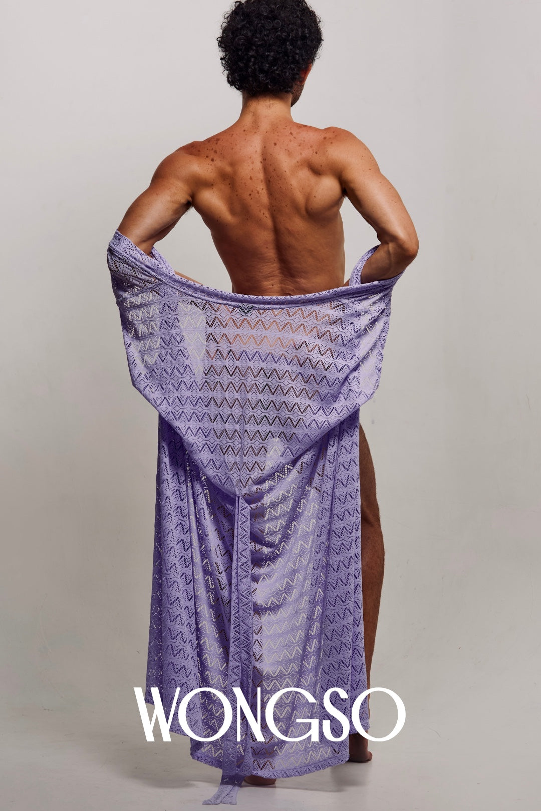 Front view of a male model with arms raised, wearing the WONGSO Lilac Sleeveless Kimono