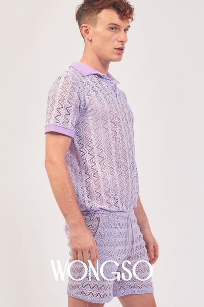 Queer man wearing the WONGSO Lilac Lace Polo Shirt styled with festival shorts