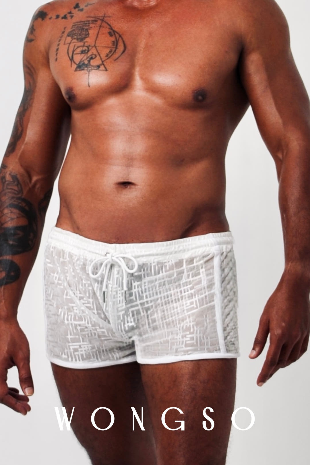 Close-up front view of the silver-thread mesh texture on WONGSO's sheer men's shorts