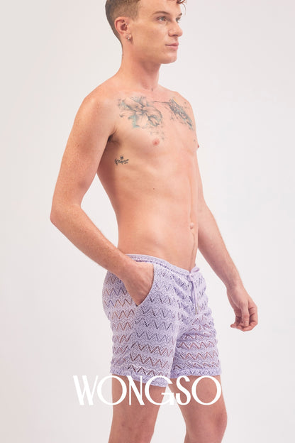 Full body front view of a male model wearing the WONGSO Lilac Lace Festival Shorts
