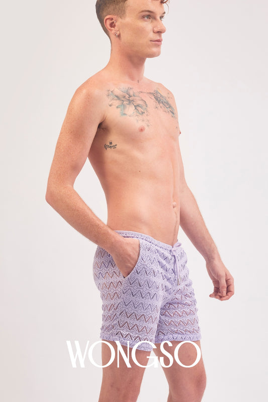 Full body front view of a male model wearing the WONGSO Lilac Lace Festival Shorts