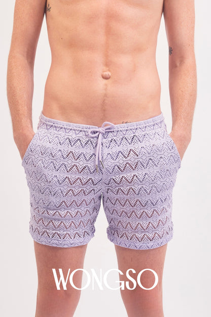 Close-up front view of the sheer lilac lace texture on WONGSO's festival shorts