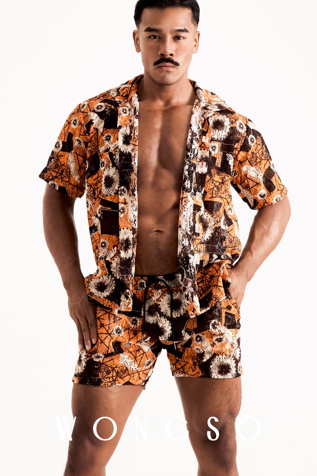 Close-up of the WONGSO men's sheer orange floral camp collar shirt showcasing the translucent fabric and tonal buttons