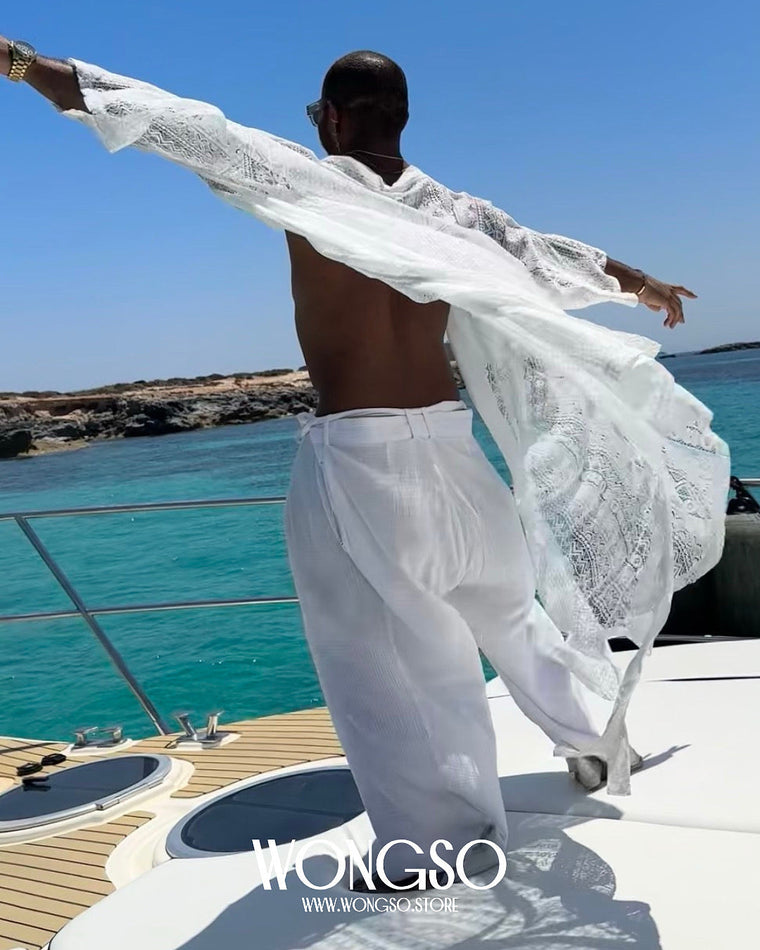 Back view of a man wearing the WONGSO White Lace Festival Kimono on a yacht deck